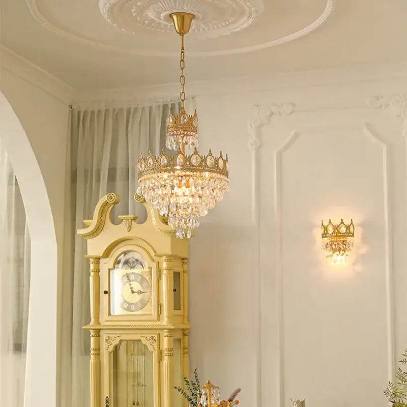Decorbites crown crystal gold chandelier pendant light with intricate detailing and crystal droplets for bedroom