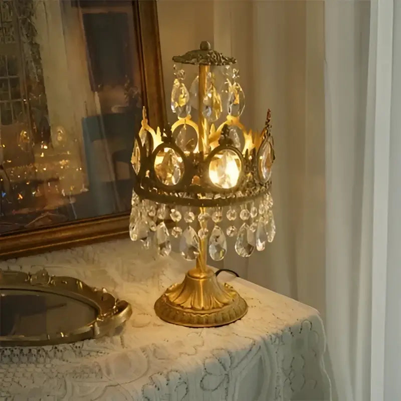 Golden ornate table lamp with dangling crystal droplets and circular glass panels from decorbites crown crystal collection