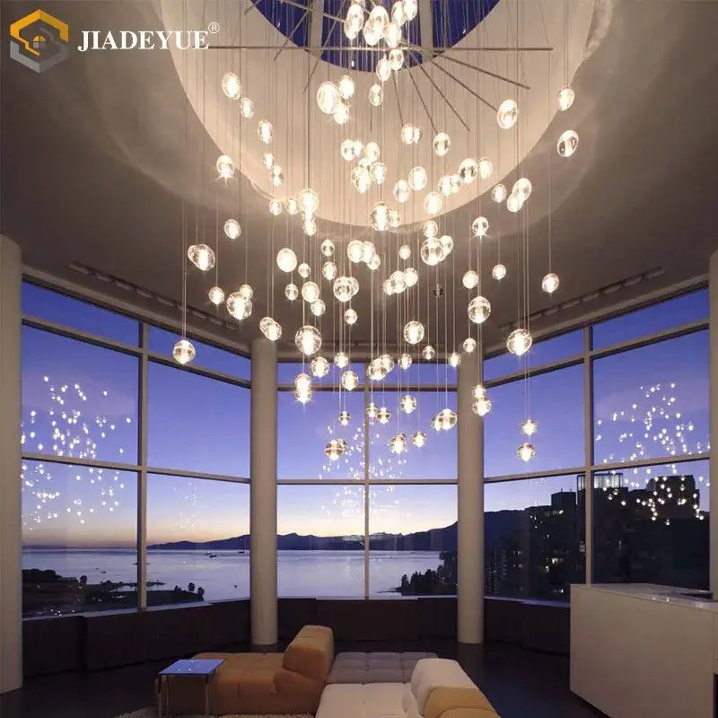 A modern decorbites crystal ball chandelier with clear spherical glass orbs and a metallic frame for dining rooms