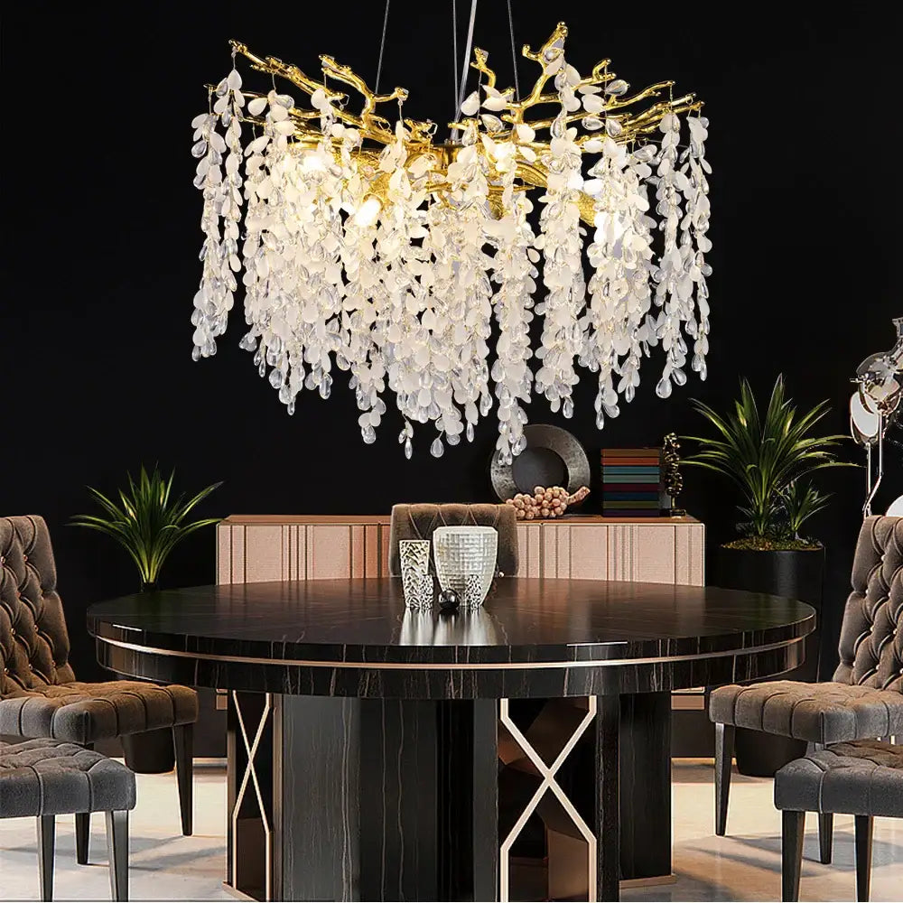 A golden decorbites crystal branch chandelier with cascading white glass leaves for living room lighting