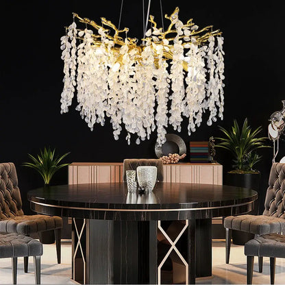 A golden decorbites crystal branch chandelier with cascading white glass leaves for living room lighting