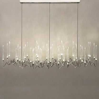 Modern decorbites crystal branch chandelier in gold with chrome-finished wave-like arms and clear glass candle bulbs
