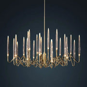 Gold-toned decorbites crystal branch chandelier with slender glass arms and intricate metalwork for dining room lighting