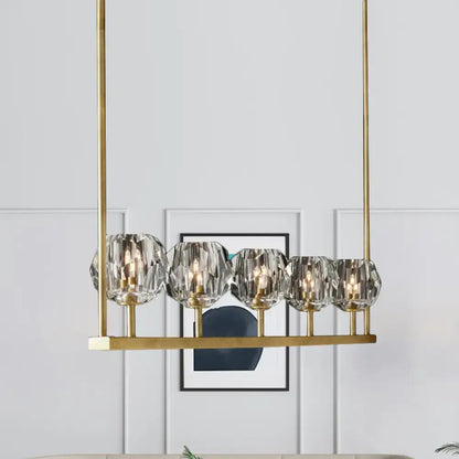 DecorBites crystal brass island ceiling suspension lamp with five faceted crystal globe shades and slender rods