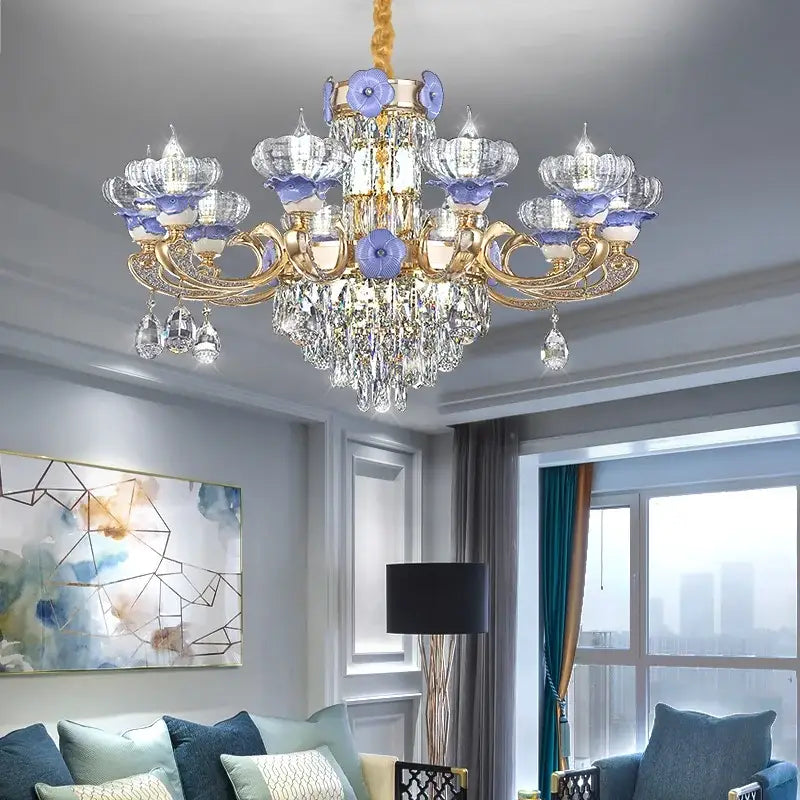 Elegant gold-toned decorbites crystal candle chandelier with crystal droplets and purple glass flower accents for living rooms