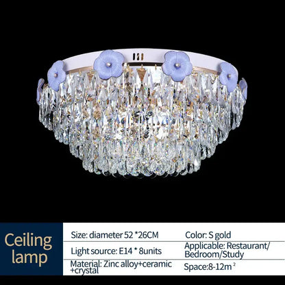 Decorbites crystal candle chandelier with circular white base, light purple floral accents, and cascading clear crystals