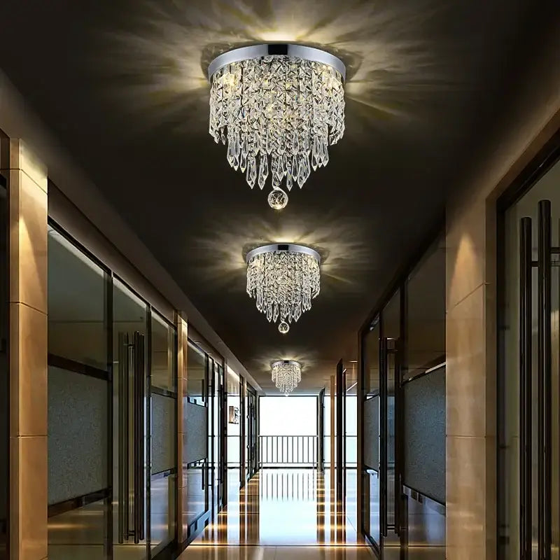 Decorbites crystal ceiling chandelier with sleek chrome base and cascading faceted glass droplets for luxury living room lighting