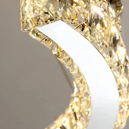Decorbites crystal ceiling chandelier with modern curved white metal frame and faceted golden crystals for indoor lighting