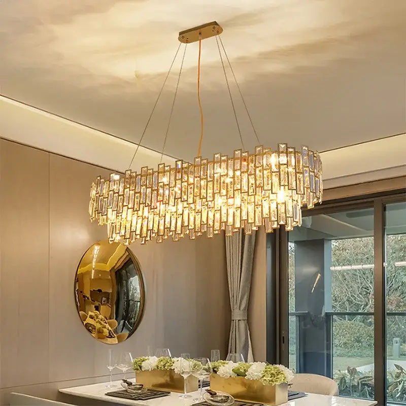 Gold-toned decorbites crystal ceiling chandelier with cascading rectangular crystal prisms in stainless steel lustre