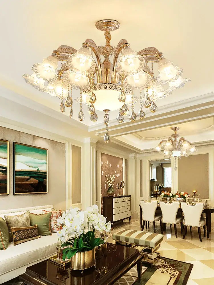 Gold-toned decorbites crystal ceiling chandelier with crystal droplets and frosted glass shades for luxury living spaces