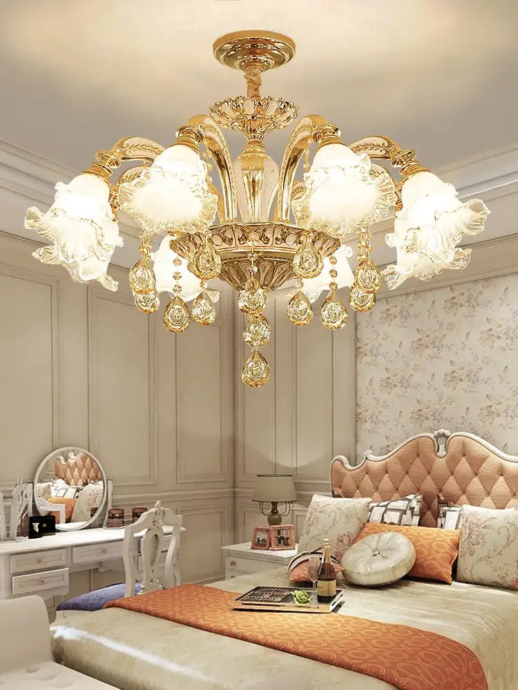 Gold-toned decorbites crystal ceiling chandelier with ornate crystal droplets and frosted glass flower-shaped shades for luxury spaces