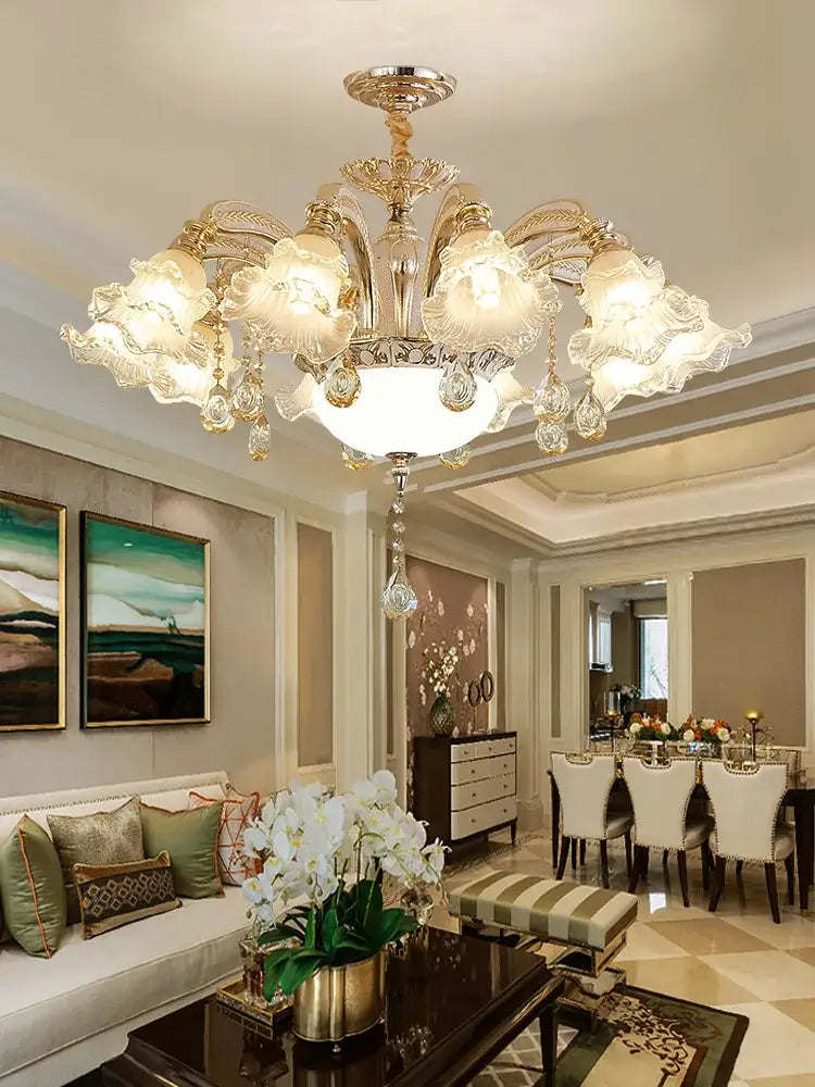 Gold-toned decorbites crystal ceiling chandelier with intricate crystal droplets and frosted glass shades for luxury living rooms