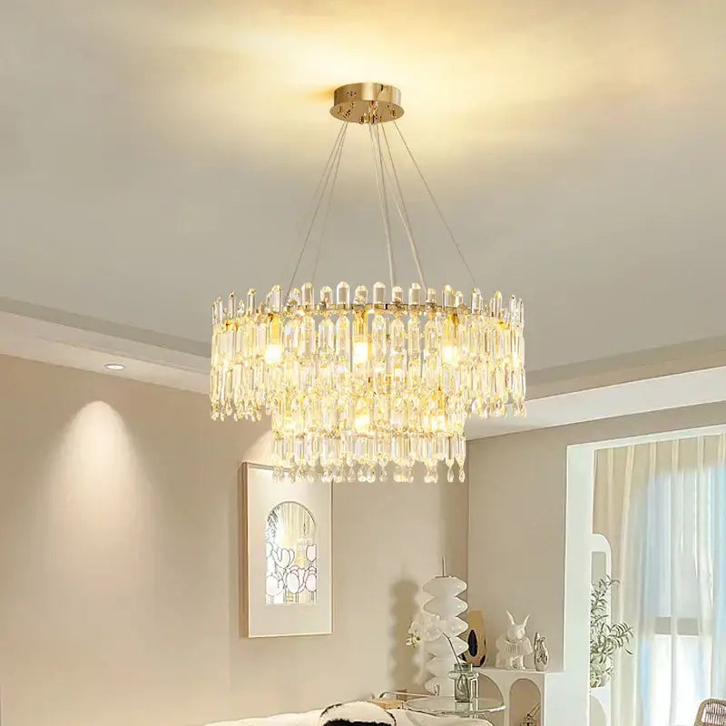 A decorbites crystal ceiling chandelier with gold-toned mount and clear glass prisms for indoor luxury lighting
