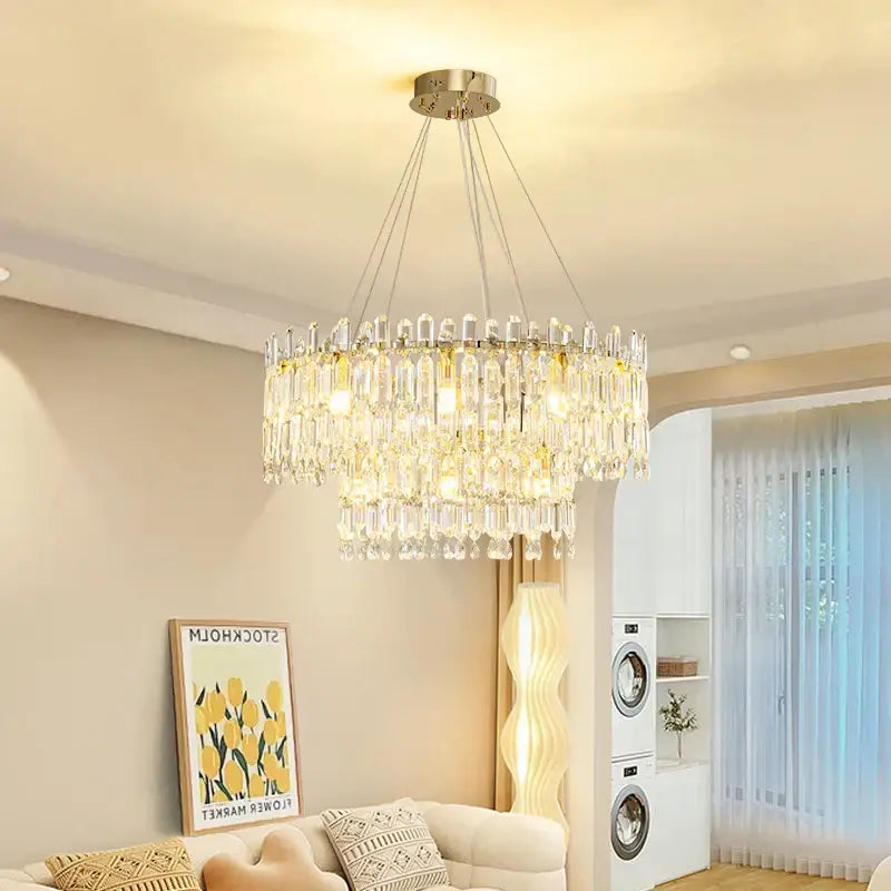 A decorbites crystal ceiling chandelier featuring multiple tiers of clear faceted glass rods with a metallic mount