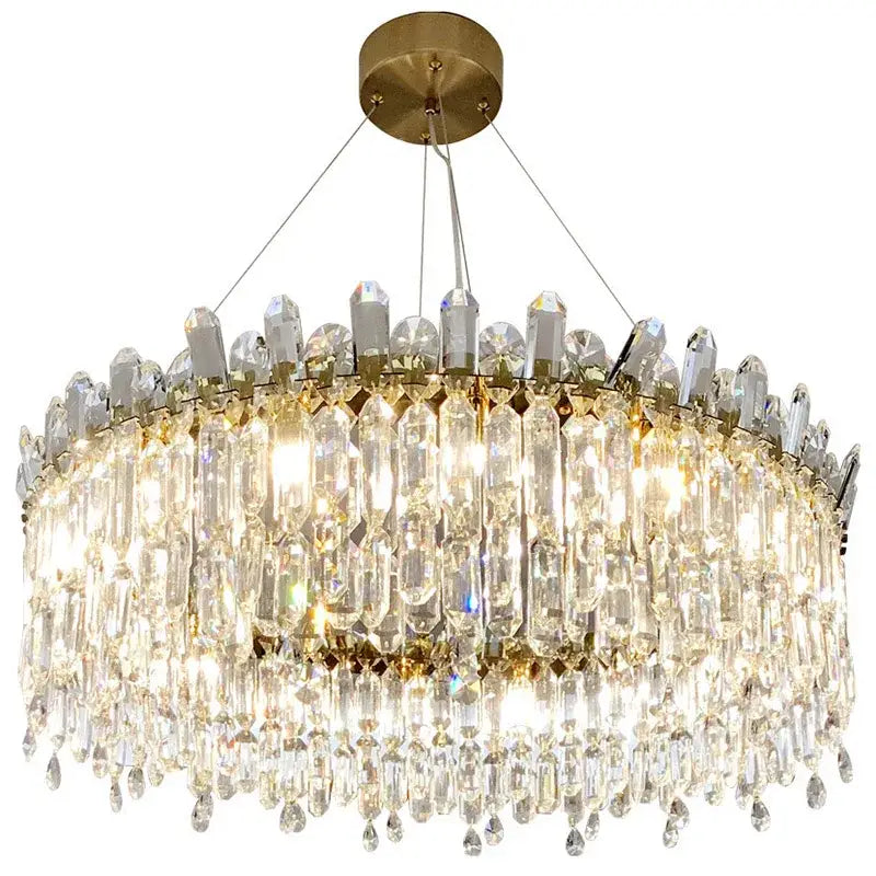 A luxurious gold-toned decorbites crystal ceiling chandelier with cascading clear crystal prisms for indoor luxury lighting