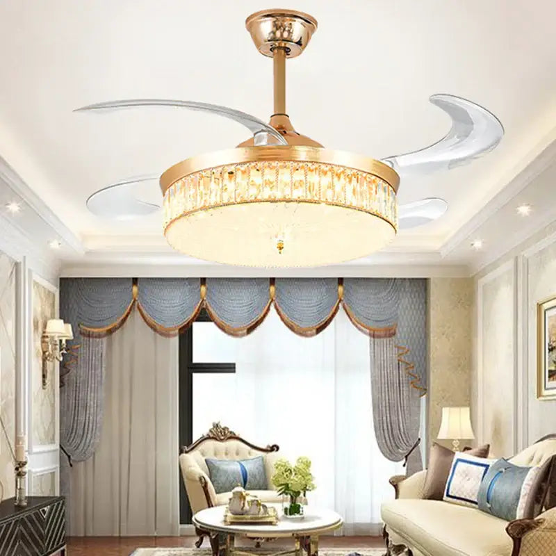 Gold-toned decorbites crystal ceiling fan with LED light, remote control, crystal-encrusted fixture, and translucent curved blades