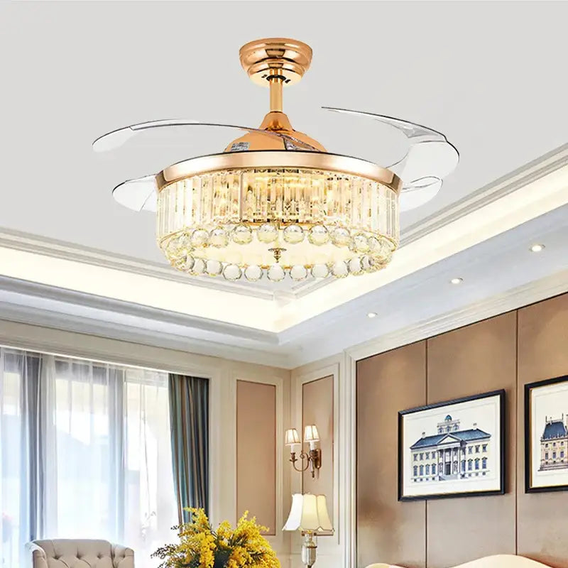 Gold-toned DecorBites crystal ceiling fan with LED light integrated chandelier and transparent blades with remote control