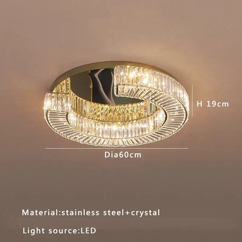 A decorbites crystal ceiling lamp with gold-toned stainless steel frame and multi-tier clear crystal prisms illuminated by led lights