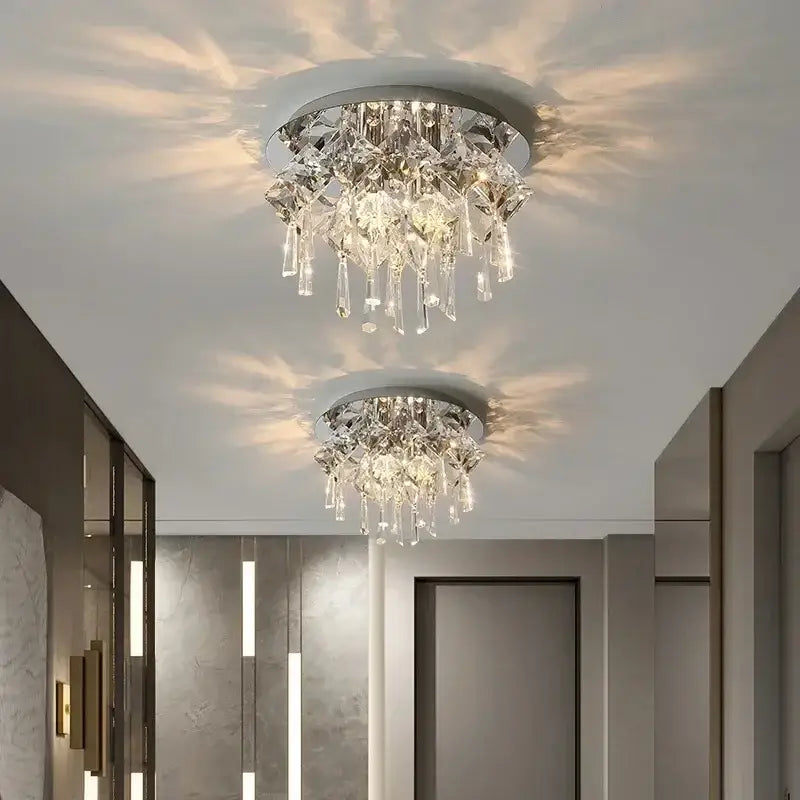 Two elegant DecorBites crystal ceiling lamps with clear faceted crystals and chrome metal frames for indoor lighting
