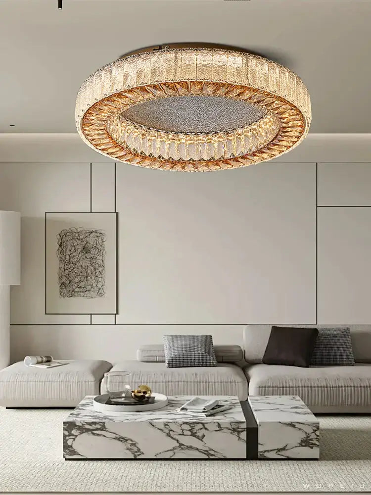 DecorBites crystal ceiling lamp with concentric clear and amber crystal rings and a textured metallic disc centerpiece