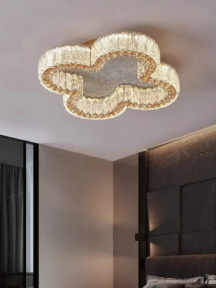 A decorbites crystal ceiling lamp with clear crystals gold frame modern cloud-shaped luxury ceiling lamp design
