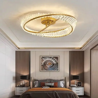 Gold-toned decorbites crystal ceiling lamp with circular rings and crystal accents for modern dining rooms