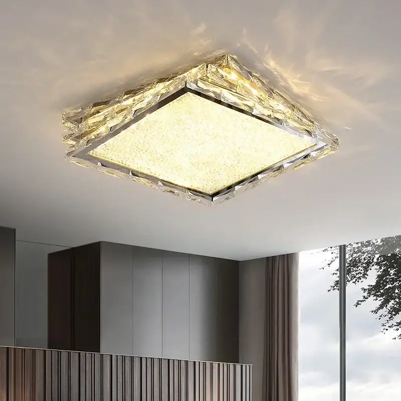 Square decorbites crystal ceiling lamp with textured golden crystal frame and warm glowing LED panel for living room