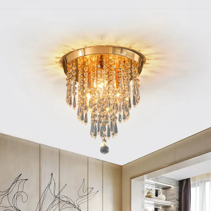 Gold-toned crystal ceiling light by DecorBites with cascading teardrop crystals and a central pendant for elegant home decor