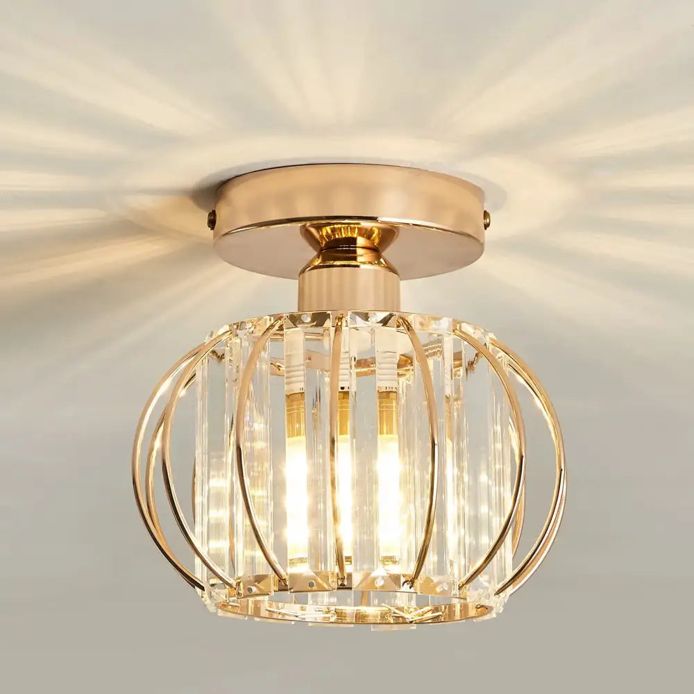 Gold-toned decorbites crystal ceiling light fixture with crystal cage design and vertical glass rods for modern spaces