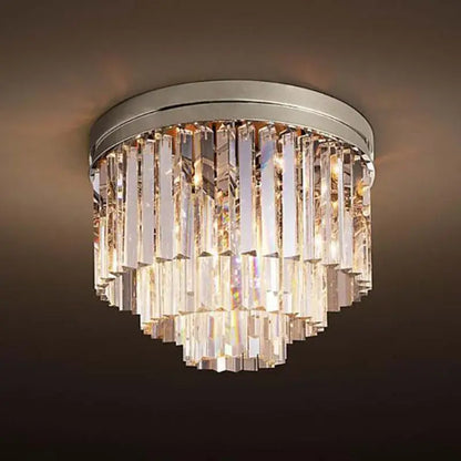 A modern decorbites crystal ceiling light with a sleek chrome base and cascading clear faceted glass prisms