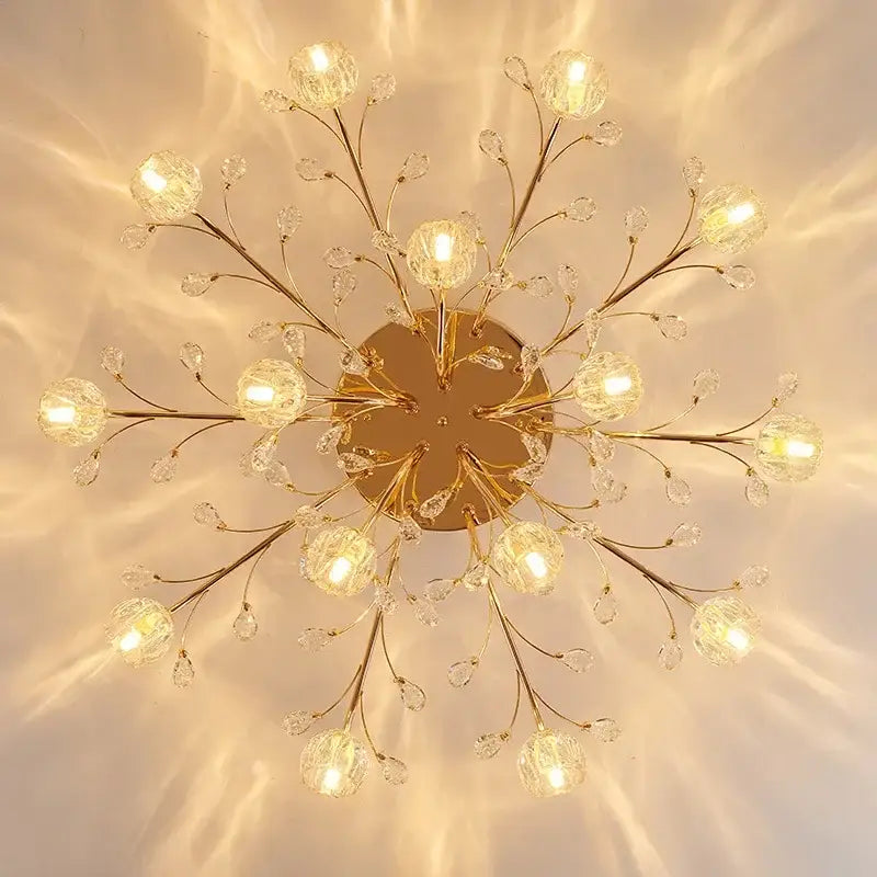 Gold-toned decorbites crystal ceiling light with crystal branches and spherical glass globes for modern luxury spaces
