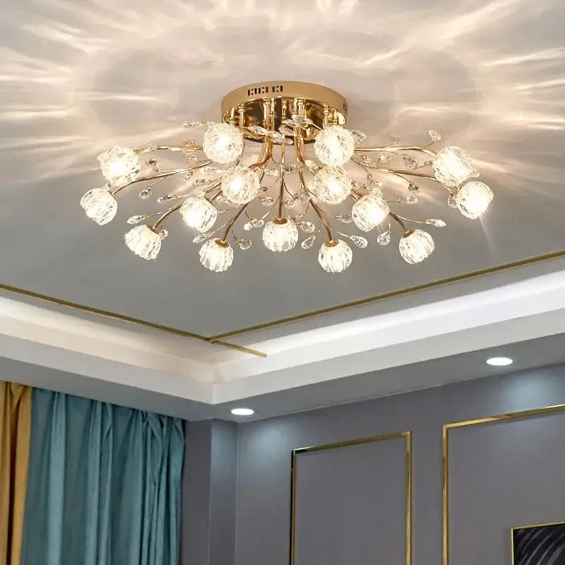 Gold-toned decorbites crystal ceiling light with crystal spherical bulbs and delicate branches for modern luxury living spaces