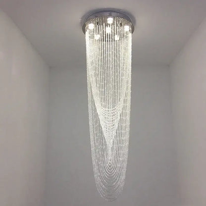 A modern decorbites crystal ceiling light with sleek chrome fixture and cascading clear beads for stairs and living rooms