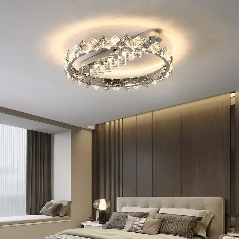 A modern decorbites crystal ceiling light with a sleek chrome frame and clear crystal accents for living room and bedroom