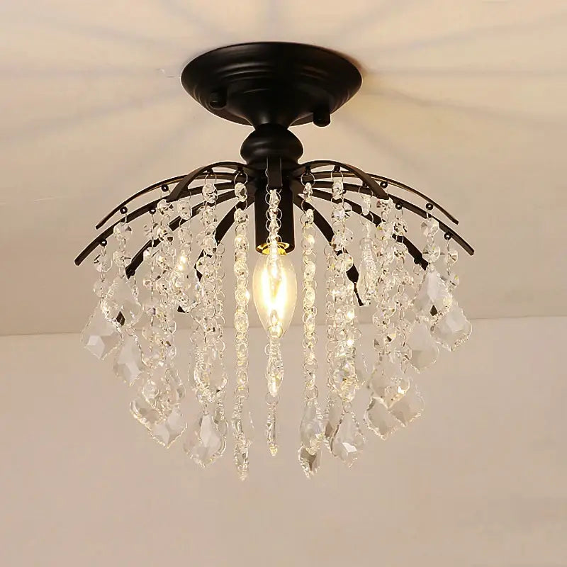 Black metal decorbites crystal ceiling light with cascading clear crystal droplets and central exposed bulb for modern luxury