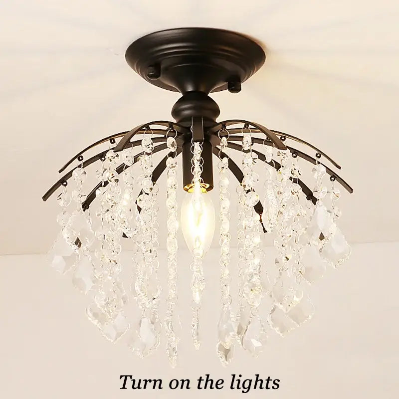 Black metal decorbites crystal ceiling light with cascading clear crystal droplets for modern luxury spaces