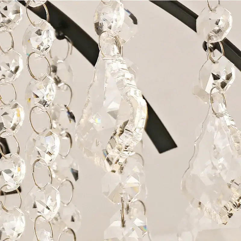 Decorbites crystal ceiling light featuring clear faceted crystal beads and teardrop pendants on black metal frame