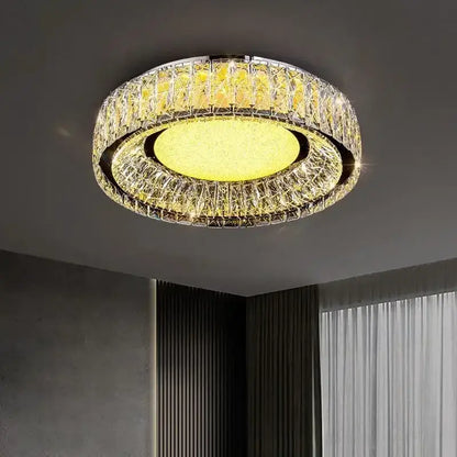 DecorBites crystal ceiling light with warm yellow glow and faceted clear crystal rings in polished chrome frame for modern luxury