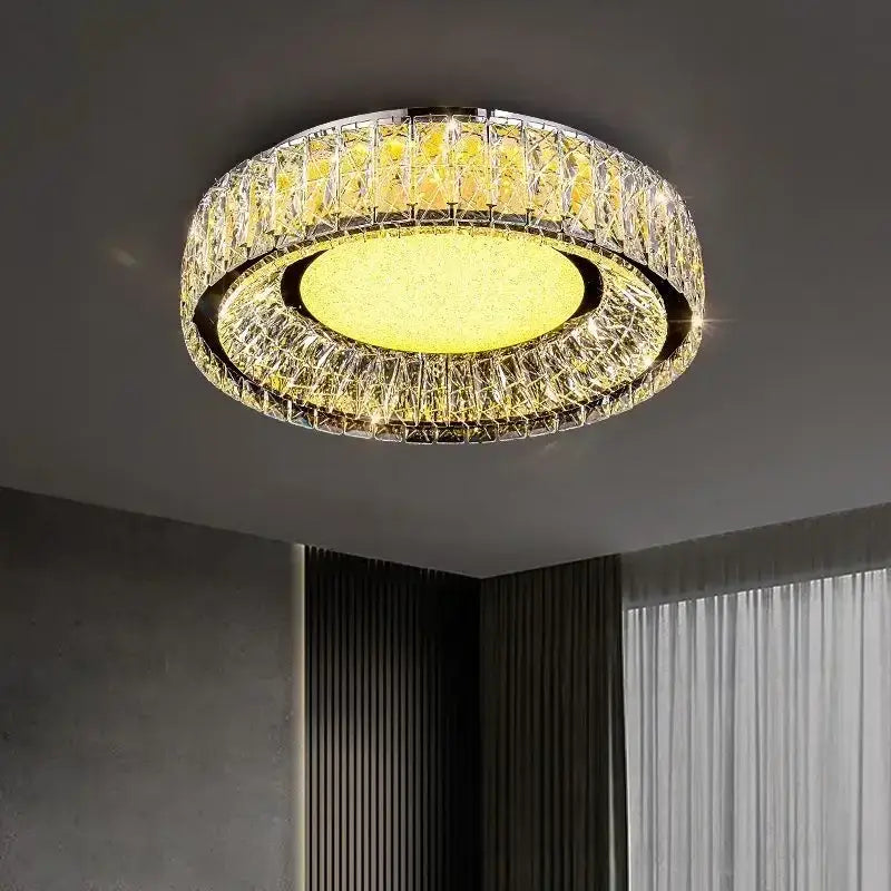 DecorBites crystal ceiling light with warm yellow glow and faceted clear crystal rings in polished chrome frame for modern luxury