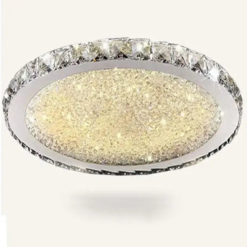 A decorbites crystal ceiling light with sparkling gold center and clear crystal ring in sleek chrome frame for living room