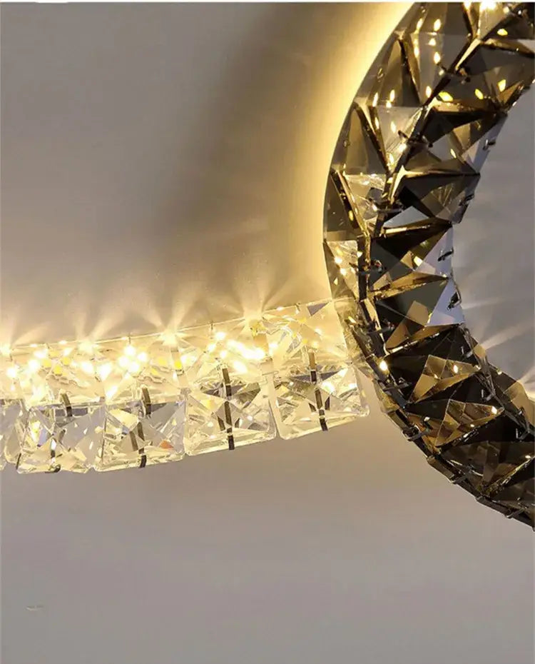 A modern decorbites crystal ceiling led chandelier with faceted crystals and warm light for living room or bedroom
