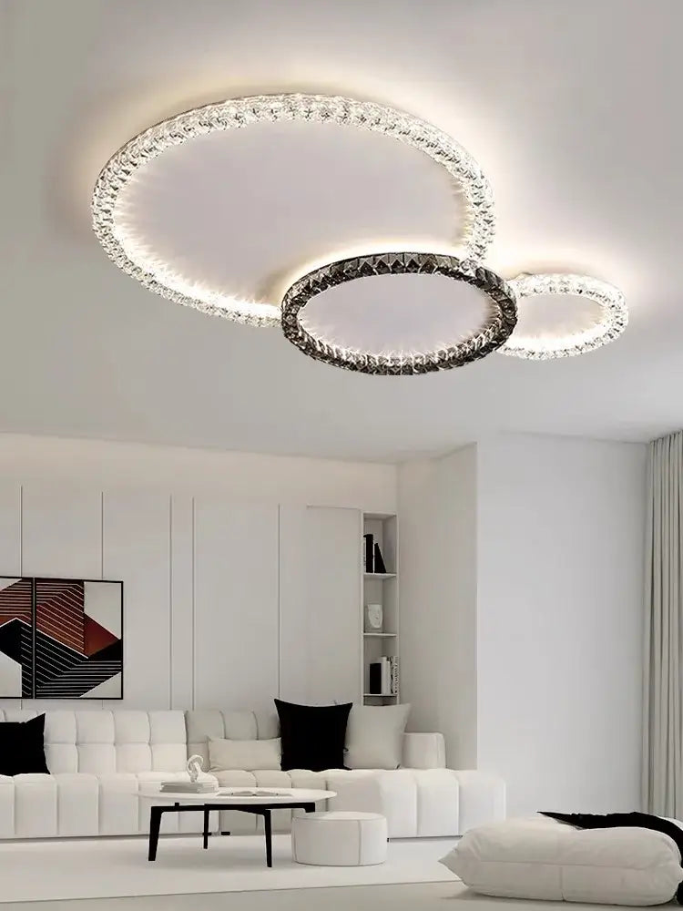 DecorBites crystal ceiling light with three interlocking crystal-encrusted rings in black and clear for living spaces