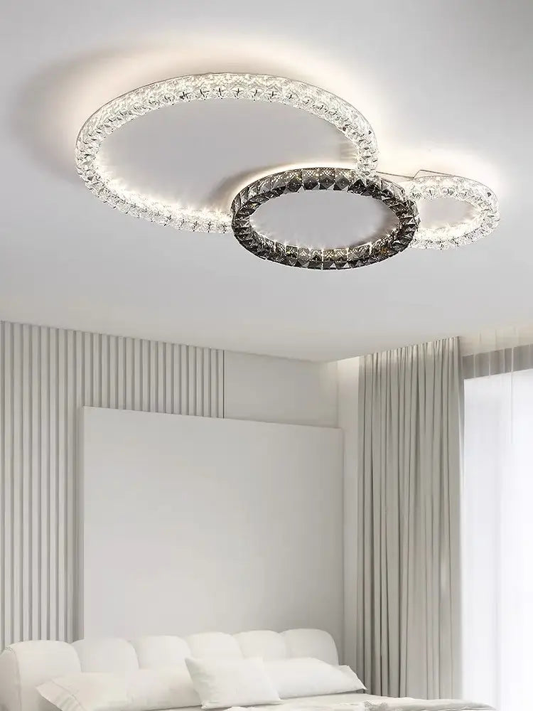 DecorBites crystal ceiling led chandelier with two interlocking rings and clear dark faceted crystals in metallic frame