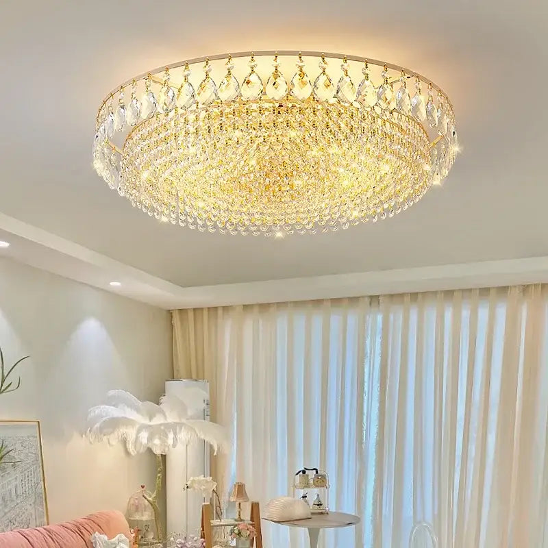 Golden crystal ceiling lights with multiple tiers of dangling teardrop crystals in a circular frame for elegant decor