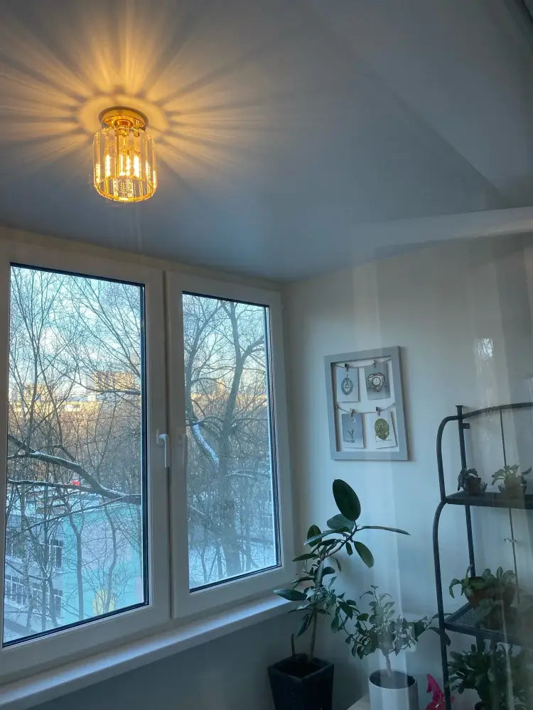 Golden crystal chandelier with warm radiant glow from decorbites crystal ceiling lights for modern living room lighting