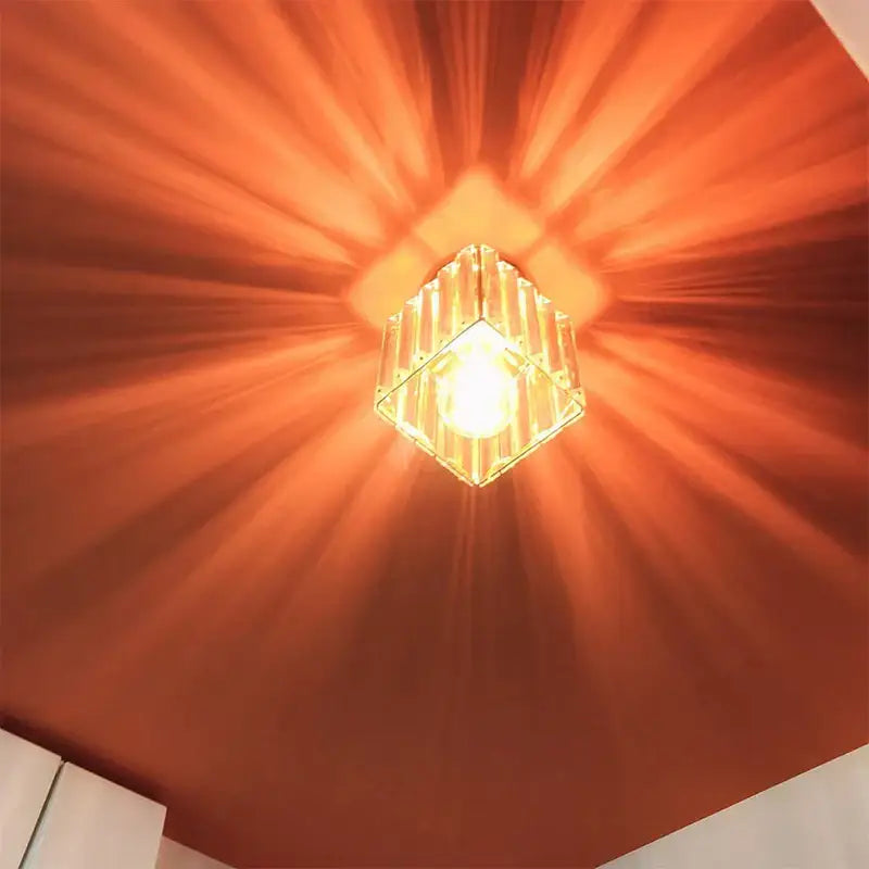 Warm glowing decorbites crystal ceiling light with faceted glass design for modern living room and bedroom decor