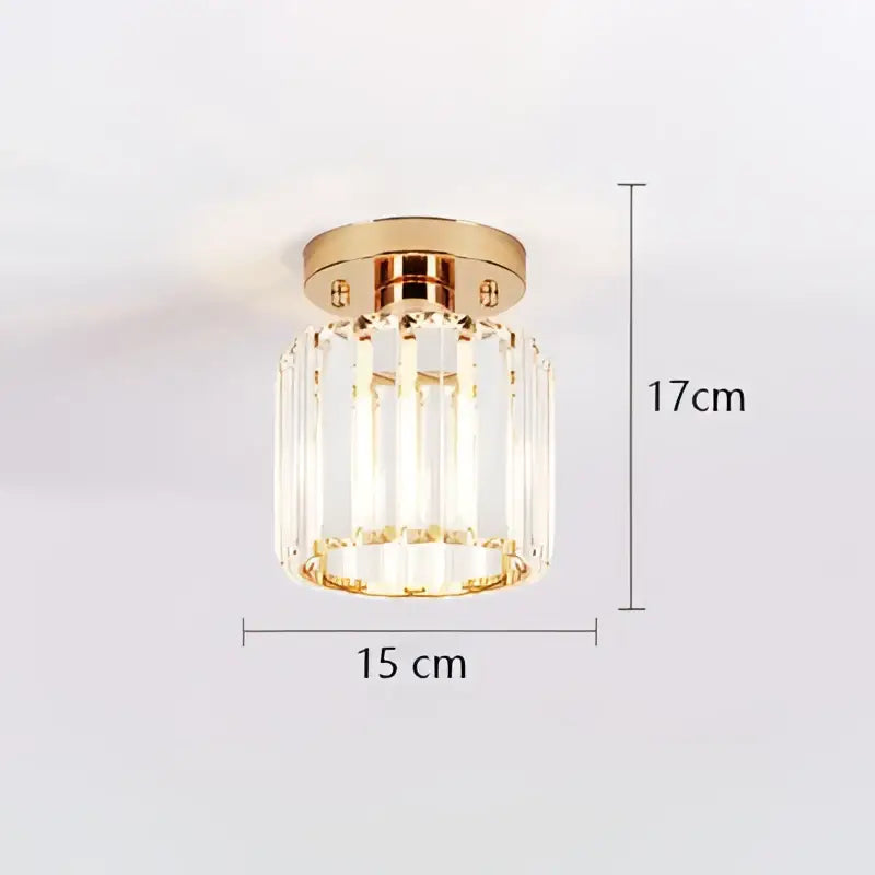 A 17cm tall decorbites crystal ceiling light with polished gold base and clear crystal prisms for modern decor