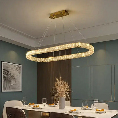 Gold-toned oval decorbites crystal ceiling chandelier with crystal-encrusted design for modern luxury lighting
