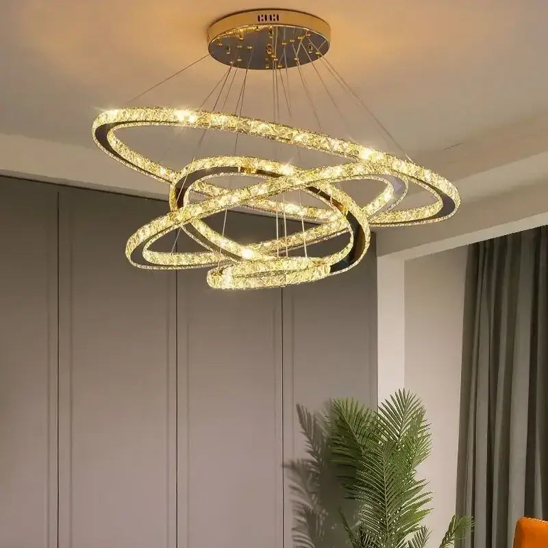 Golden crystal ceiling pendant light with interlocking rings and embedded lights by DecorBites for modern decor