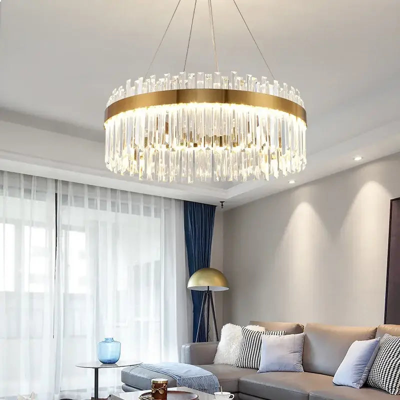 Gold-toned decorbites crystal ceiling pendant light with cascading clear crystal prisms for living and dining rooms